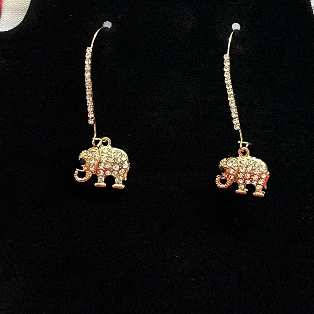 Gold tone earring with elephant